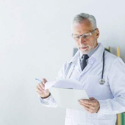 serious-doctor-reading-records
